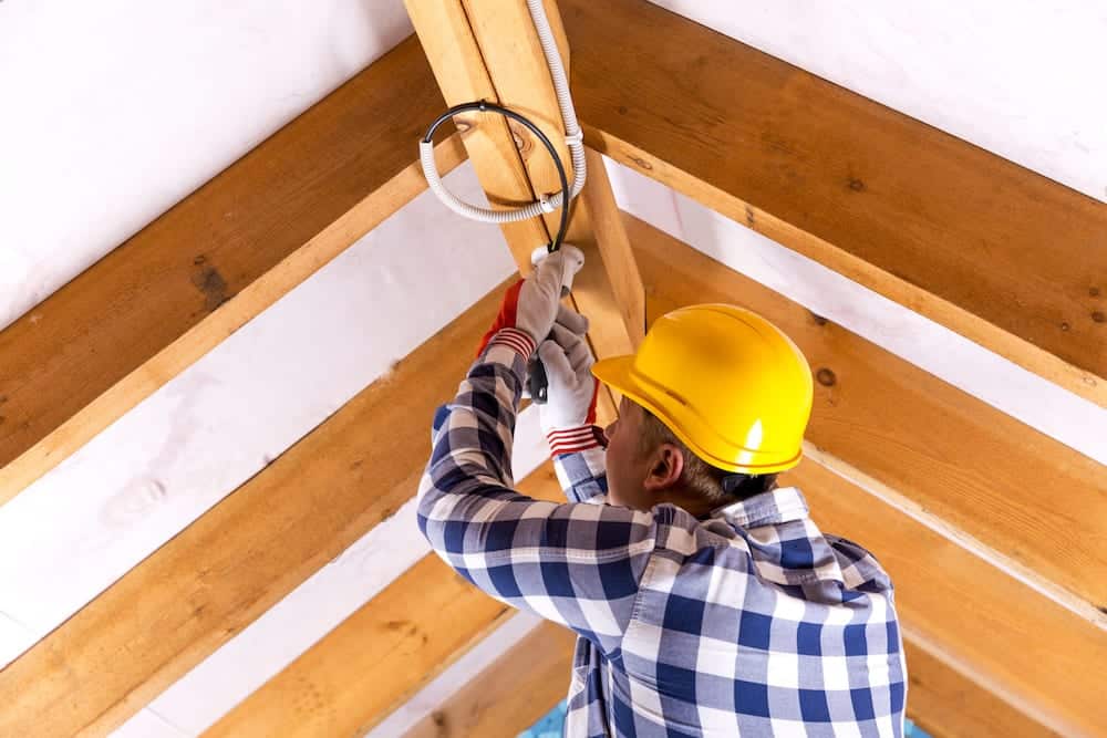 Electrician Fixing Attic Wirings - 3 Reasons To Leave Attic Electrical Work to the Experts graphic