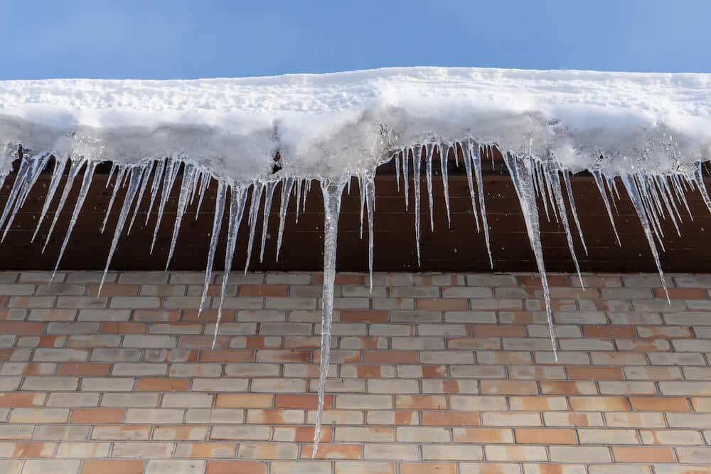 house with icicles hanging off of the roof