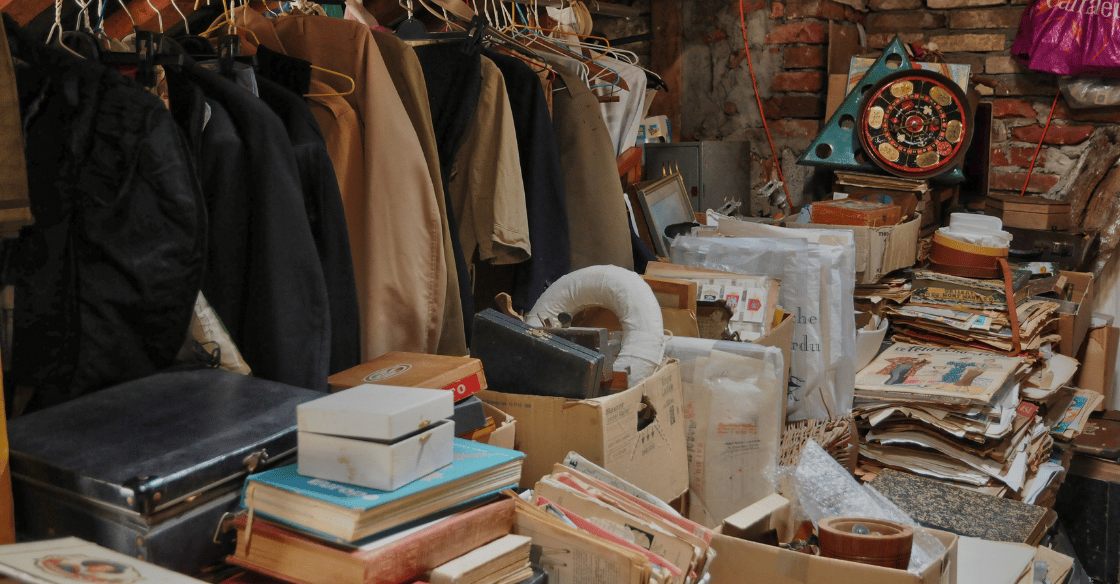 Clutter in an attic, posing a threat to electrical attic hazards.