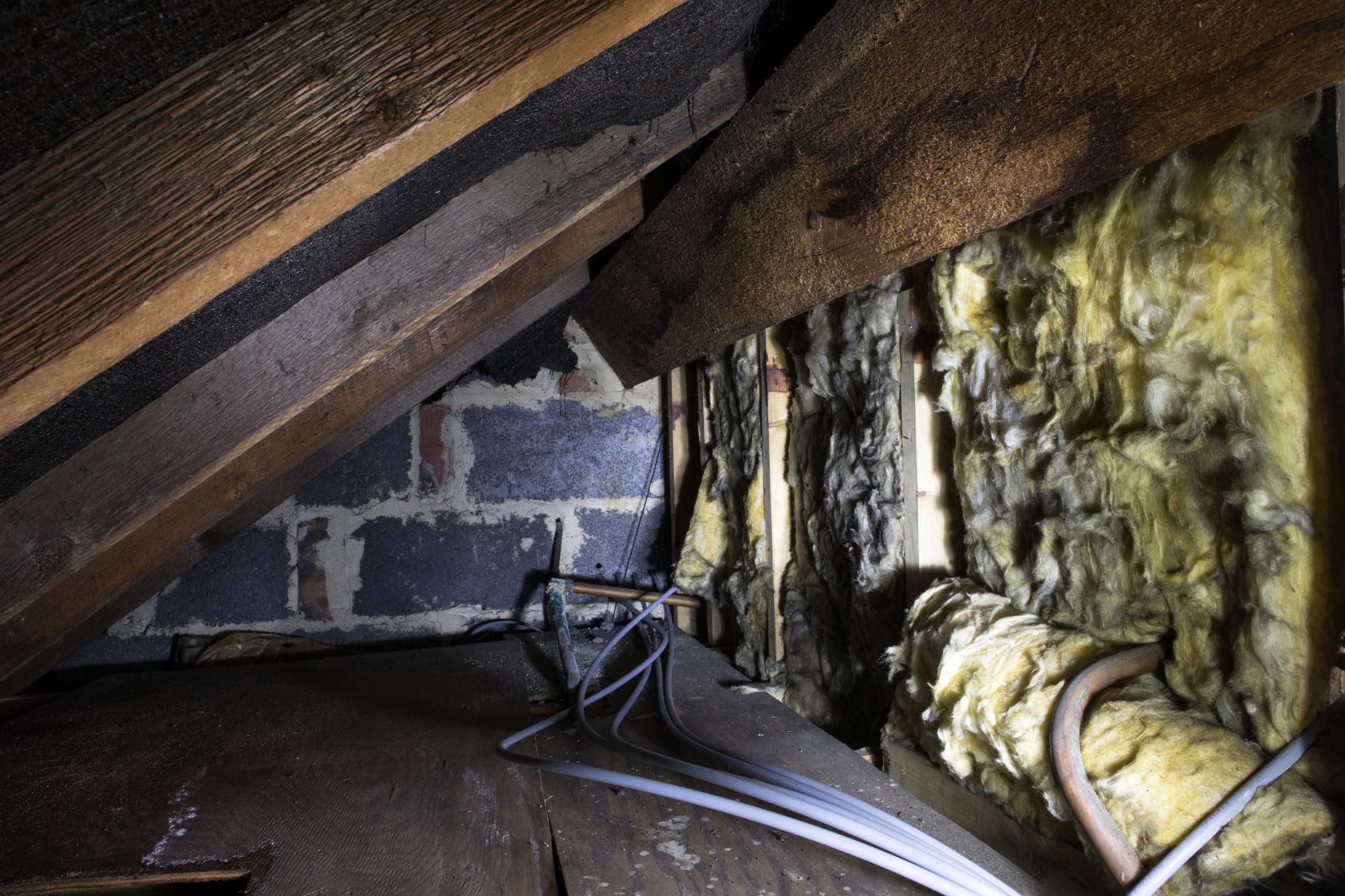 Old Insulation in Attic - Why Old Knob And Tube Wiring Is A Fire Risk In The Attic scaled graphic
