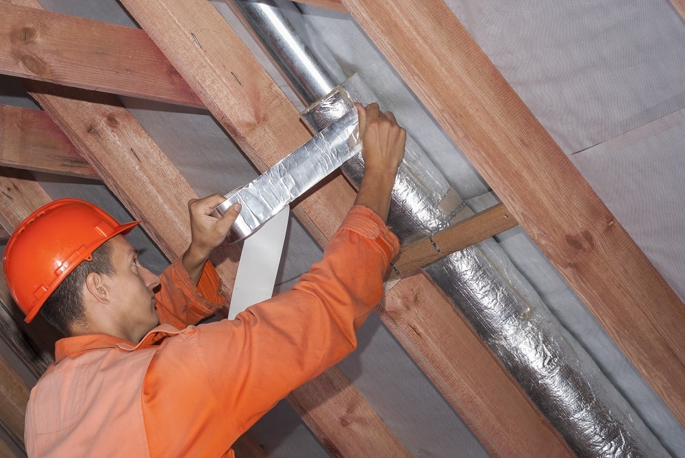 Home Inspector Fixing Air Duct - When To Inspect Air Ducts graphic